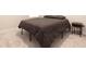 A cozy bedroom features a comfortable gray bed with a side table at 13246 Twin Bridges Dr, Riverview, FL 33579