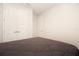 A bedroom has gray carpeting, white walls, and white closets at 13246 Twin Bridges Dr, Riverview, FL 33579
