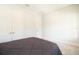 A bedroom has gray carpeting, white walls, and white closets at 13246 Twin Bridges Dr, Riverview, FL 33579
