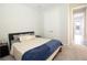 A carpeted bedroom features a double door closet and small doorway at 13246 Twin Bridges Dr, Riverview, FL 33579