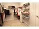 Walk-in closet equipped with shelving, shoe racks, and hanging space for storing shoes, clothing, and accessories at 13246 Twin Bridges Dr, Riverview, FL 33579