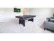 A spacious game room featuring a ping pong table and comfortable seating at 13246 Twin Bridges Dr, Riverview, FL 33579