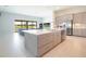 Spacious open-concept kitchen featuring a large island, stainless steel appliances, and contemporary finishes, perfect for entertaining at 13246 Twin Bridges Dr, Riverview, FL 33579