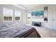 Comfortable main bedroom with carpet, big windows overlooking the lake, and large TV at 13246 Twin Bridges Dr, Riverview, FL 33579