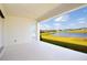 White patio showcasing beautiful lake views and a door to access backyard entertainment at 13246 Twin Bridges Dr, Riverview, FL 33579