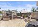 Inviting backyard with stone patio, lounge chairs, and wooden deck under the bright, sunny sky at 1344 Dartmouth Dr, Holiday, FL 34691