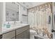 Modern bathroom features a sleek vanity, shower and bath combo, and stylish fixtures at 1344 Dartmouth Dr, Holiday, FL 34691