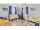 This bedroom offers hardwood floors, bright natural light, and ample closet space at 1344 Dartmouth Dr, Holiday, FL 34691