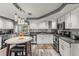 A bright and modern kitchen featuring stainless steel appliances and ample cabinet space at 1344 Dartmouth Dr, Holiday, FL 34691