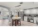 Bright eat-in kitchen features stainless appliances, hardwood floors, and stylish pendant lighting at 1344 Dartmouth Dr, Holiday, FL 34691