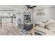 Open concept living room with views of kitchen and dining areas at 1344 Dartmouth Dr, Holiday, FL 34691