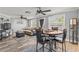 Open-concept living with a dining area and a comfortable sectional couch at 1344 Dartmouth Dr, Holiday, FL 34691
