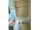Well-lit bathroom with tiled shower-tub combination, vanity, and neutral color scheme at 13833 Orange Sunset Dr # 201, Tampa, FL 33618