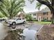 Exterior view of the property with well-kept landscaping and ample parking available at 13833 Orange Sunset Dr # 201, Tampa, FL 33618