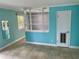 Bright living room featuring tile flooring and a open view to the kitchen at 13833 Orange Sunset Dr # 201, Tampa, FL 33618