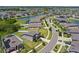 An aerial view shows the property with pond views and the nearby golf course at 13871 Carlow Park Dr, Riverview, FL 33579