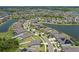 An aerial view shows the neighborhood with pond views and the nearby golf course at 13871 Carlow Park Dr, Riverview, FL 33579