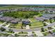 An aerial view of the property showing the surrounding neighborhood and landscaping at 13871 Carlow Park Dr, Riverview, FL 33579