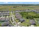 Aerial view shows neighborhood featuring homes, lawns and green space at 13871 Carlow Park Dr, Riverview, FL 33579