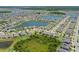 Wide aerial perspective displays homes with views of ponds and community landscaping at 13871 Carlow Park Dr, Riverview, FL 33579