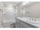 Bathroom featuring double vanity, a shower with tub, and updated fixtures at 13871 Carlow Park Dr, Riverview, FL 33579