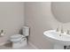 Compact bathroom featuring a pedestal sink and standard toilet at 13871 Carlow Park Dr, Riverview, FL 33579