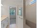 Bathroom view with a double vanity, and doorway to bedroom and shower at 13871 Carlow Park Dr, Riverview, FL 33579