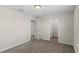 Bedroom featuring soft carpeting, neutral paint, closet, and an open door at 13871 Carlow Park Dr, Riverview, FL 33579