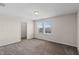 Cozy bedroom showcases plush carpeting, a window with blinds, and closet access at 13871 Carlow Park Dr, Riverview, FL 33579