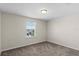 Comfortable bedroom featuring soft carpeting and a window with views at 13871 Carlow Park Dr, Riverview, FL 33579