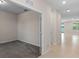 Hallway connecting carpeted and tiled rooms at 13871 Carlow Park Dr, Riverview, FL 33579