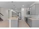 Spacious kitchen boasts grey cabinetry, stainless steel appliances, tiled backsplash and quartz countertops at 13871 Carlow Park Dr, Riverview, FL 33579