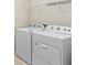 Bright laundry room featuring a side-by-side washer and dryer at 13871 Carlow Park Dr, Riverview, FL 33579