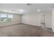 Spacious living room features large windows, neutral paint, and plush carpeting at 13871 Carlow Park Dr, Riverview, FL 33579