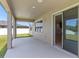 Covered patio features recessed lighting and easy access to the backyard at 13871 Carlow Park Dr, Riverview, FL 33579