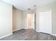 Bedroom with wood-look floors and white closet doors showcasing neutral paint and natural light at 14020 Sooty Tern Ave, Brooksville, FL 34614