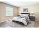 Comfortable bedroom featuring stylish decor and a window, offering a relaxing space at 14020 Sooty Tern Ave, Brooksville, FL 34614
