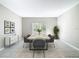 Dining room featuring a contemporary table setting, neutral walls, and sliding doors leading to outdoor space at 14020 Sooty Tern Ave, Brooksville, FL 34614