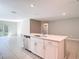 Open-concept kitchen island with stainless steel dishwasher and sink, perfect for modern living at 14020 Sooty Tern Ave, Brooksville, FL 34614