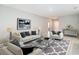 Bright living room featuring modern furniture, neutral colors, and stylish decor, creating a welcoming atmosphere at 14020 Sooty Tern Ave, Brooksville, FL 34614