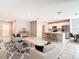 Open-concept design combining the living area, kitchen, and dining space for modern living at 14020 Sooty Tern Ave, Brooksville, FL 34614