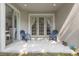 Relaxing back porch with seating, sliding glass door, and a view of the greenery at 14418 Mirabelle Vista Cir, Tampa, FL 33626