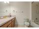 Standard bathroom with a shower-tub combination, toilet, and large countertop sink at 14418 Mirabelle Vista Cir, Tampa, FL 33626
