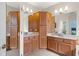 Bathroom featuring double sinks, cabinets, and a tiled floor at 14418 Mirabelle Vista Cir, Tampa, FL 33626