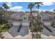 An aerial view of townhomes showing driveway, roof, and mature landscaping at 14418 Mirabelle Vista Cir, Tampa, FL 33626