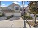 Charming townhomes with stone accents, three-car garages, and lush landscaping at 14418 Mirabelle Vista Cir, Tampa, FL 33626