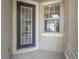 A welcoming front door with sidelight window invites you into this home at 14418 Mirabelle Vista Cir, Tampa, FL 33626