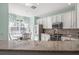 Well-lit kitchen area with stainless steel appliances and a view to the breakfast nook at 14418 Mirabelle Vista Cir, Tampa, FL 33626