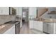 Bright kitchen features stainless steel appliances, neutral countertops, and ample cabinet space at 14418 Mirabelle Vista Cir, Tampa, FL 33626