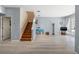 Open-concept living room featuring hardwood floors and stairs with wood steps at 14418 Mirabelle Vista Cir, Tampa, FL 33626